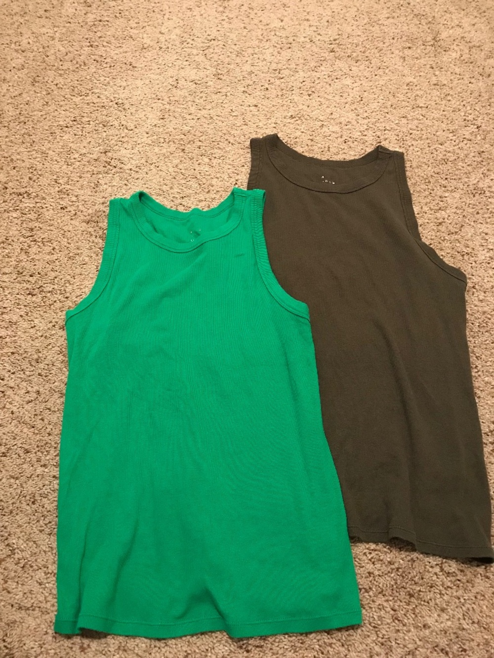 2 green tank tops